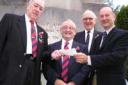 (l-r) John Hobbs, chairman of the Barry branch of the Royal British Legion and president Tim O'Sullivan MBE present a cheque to Gareth Howe and David Jenkins, chairman and treasurer of Barry Remembers.