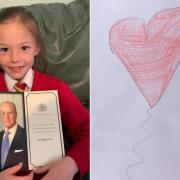 Ellie Davies (L) made a sympathy card for Queen Elizabeth II following the death of Prince Philip