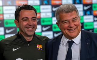 Barcelona head coach Xavi and president Joan Laporta during a press conference (Emilio Morenatti/AP)