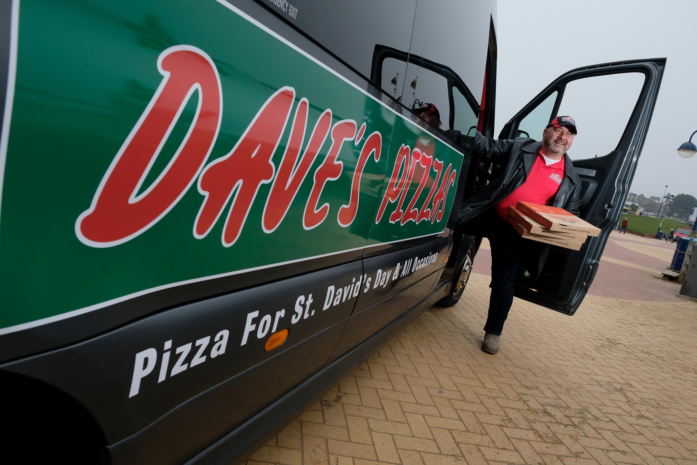 EDITORIAL USE ONLY Coach driver Dave from Barry, Wales launches Daves Pizzas delivery service, which has been set up by Papa Johns to celebrate St Davids Day. PA Photo. Picture date: Monday March 1, 2021. DaveÕs Pizzas, which is only ava