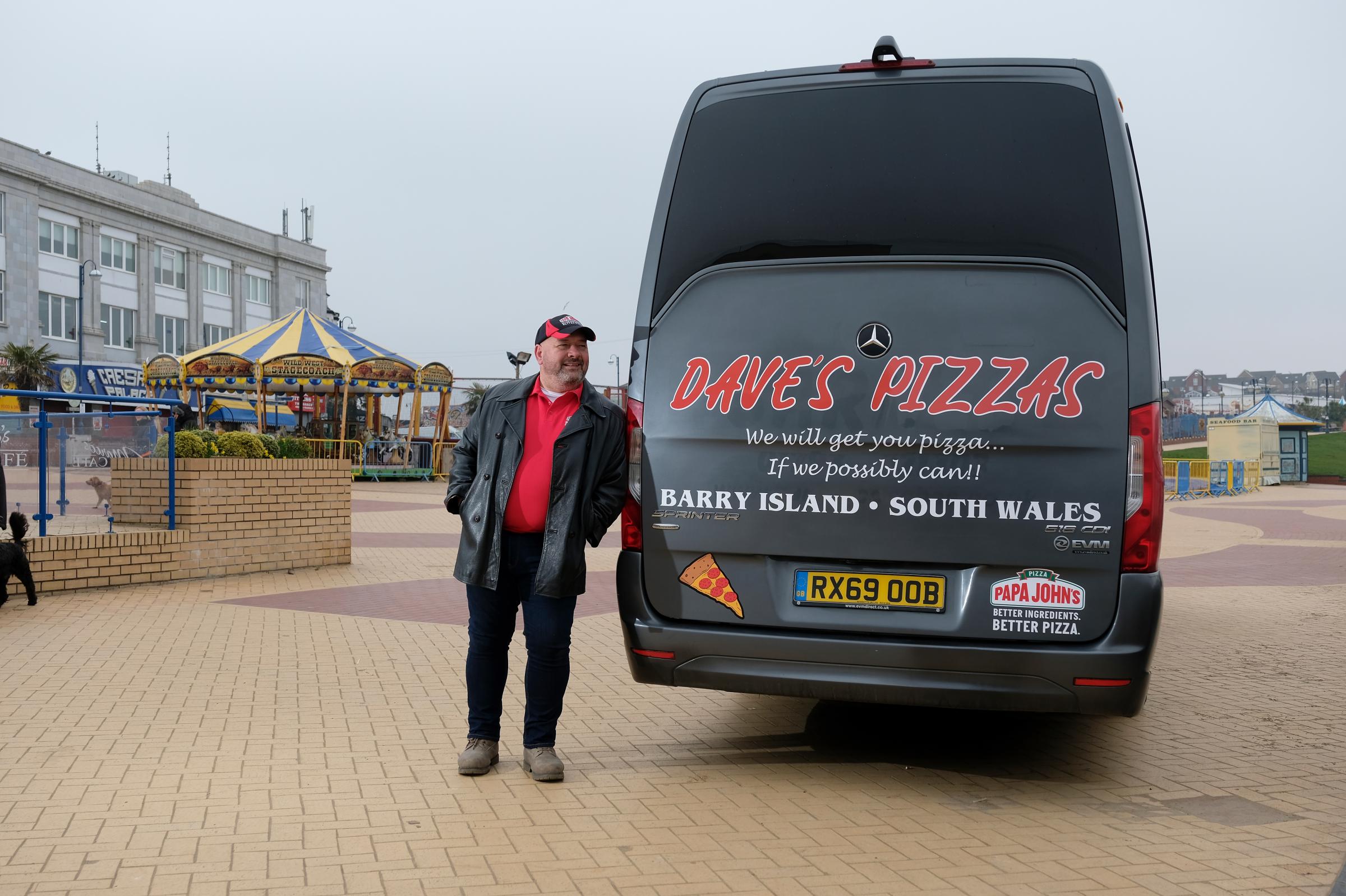 EDITORIAL USE ONLY Coach driver Dave from Barry, Wales launches Daves Pizzas delivery service, which has been set up by Papa Johns to celebrate St Davids Day. PA Photo. Picture date: Monday March 1, 2021. DaveÕs Pizzas, which is only ava