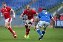 Wales' Alun Wyn Jones (left) runs at Italy's David Sisi (right) during the Guinness Six Nations match at Stadio Olimpico, Rome. Picture date: Saturday March 13, 2021.