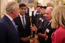 The King and Prime Minister Rishi Sunak meet guests during a reception at Buckingham Palace (Daniel Leal/PA)