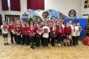 Pupils at All Saints Primary School in Barry with Cardiff Devils players Ben Bowns, Bode Wilde, Cole Ully, Ryan Barrow & Jake Melkun