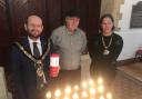 Candle lighting event with the mayor (left)
