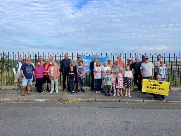 Barry And District News: Members of the Docks Incinerator Action Group gather on Dock View Road in Barry, overlooking the incinerator. Photo: Siriol Griffiths