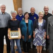 Di Davies and Gareth Davies with members of the musical team, committee and choir archivists along with president Gordon Mudford and Patron Haydn Burgess