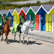 VIGILANT: Mounted police patrol Barry Island earlier in the year (Picture: Ben Birchall/PA Wire)