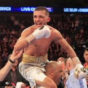 ON TOP OF THE WORLD: Lee Selby celebrates on trainer Tony Borg's shoulders after claiming the IBF world featherweight crown in May 2015