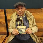 Poet Francis Page with a copy of Dock Thoughts which features his work