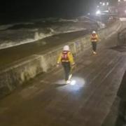 Coastguards search along the Porthcawl sea front last night, Tuesday, January 23