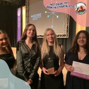 Members of Her Voice Wales group with the award for Celebrating Youth Work Excellence