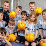 Cogan Coronation under 6 football team receives donation for new equipment