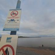 New signs up at Barry beach advising people not to swim due to water quality