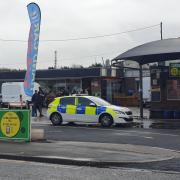 Police outside a Barry car wash
