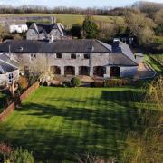 Coachhouse in Barry on Sale for almost eight hundred thousand pounds has a generous plot of land