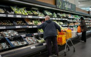PA file photo of shoppers in a supermarket. Picture: Aaron Chown/PA