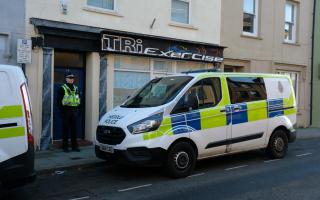 Officers at the scene of the incident in Upper Market Street in Haverfordwest.
